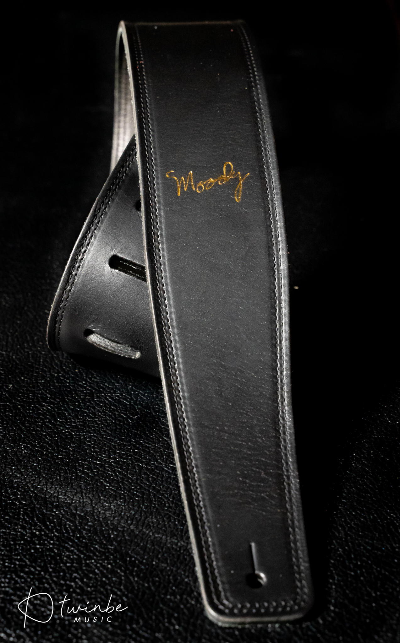 Moody 2.5″ LEATHER BACKED GUITAR STRAP – BLACK/CREAM-GOLD LOGO